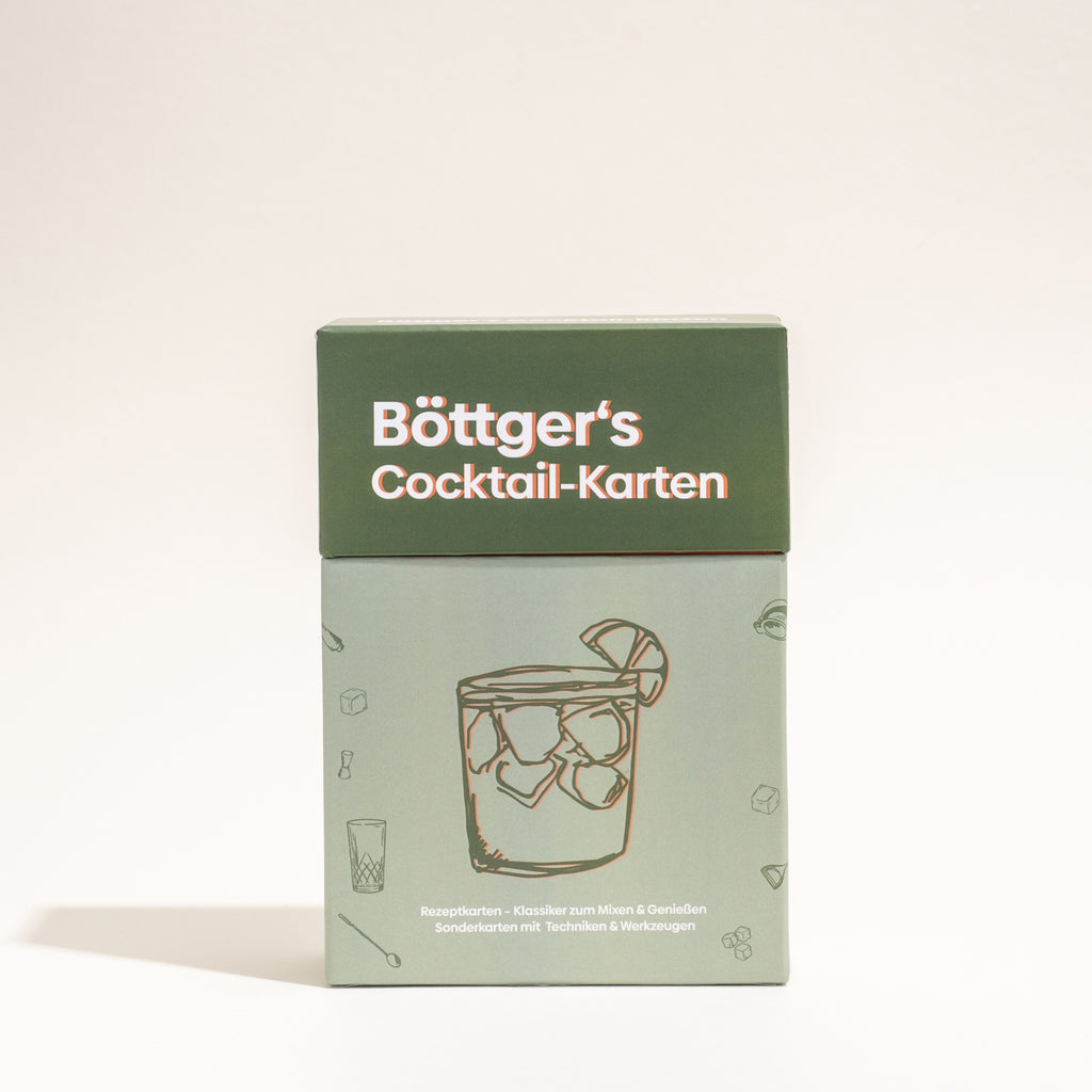 Eine grün gestaltete Box mit Böttger's Cocktail-Karten für Klassiker und Mixgetränke.